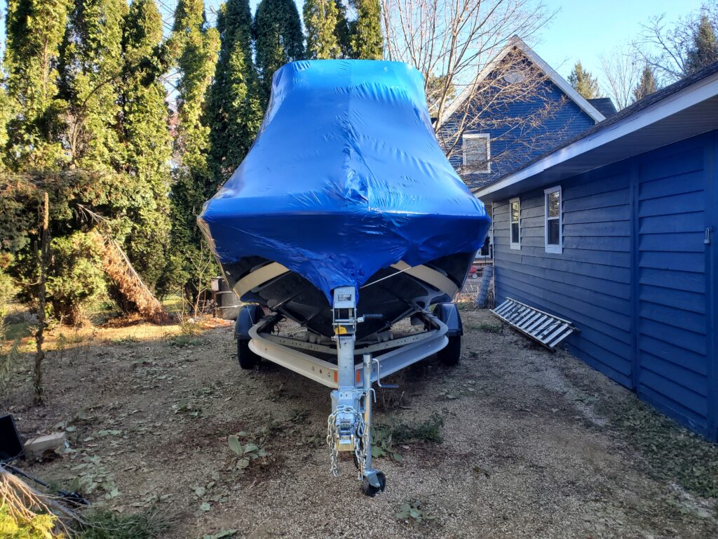 Runabout With Radar Bridge Shrink-Wrap for Winter Storage at Client Location.